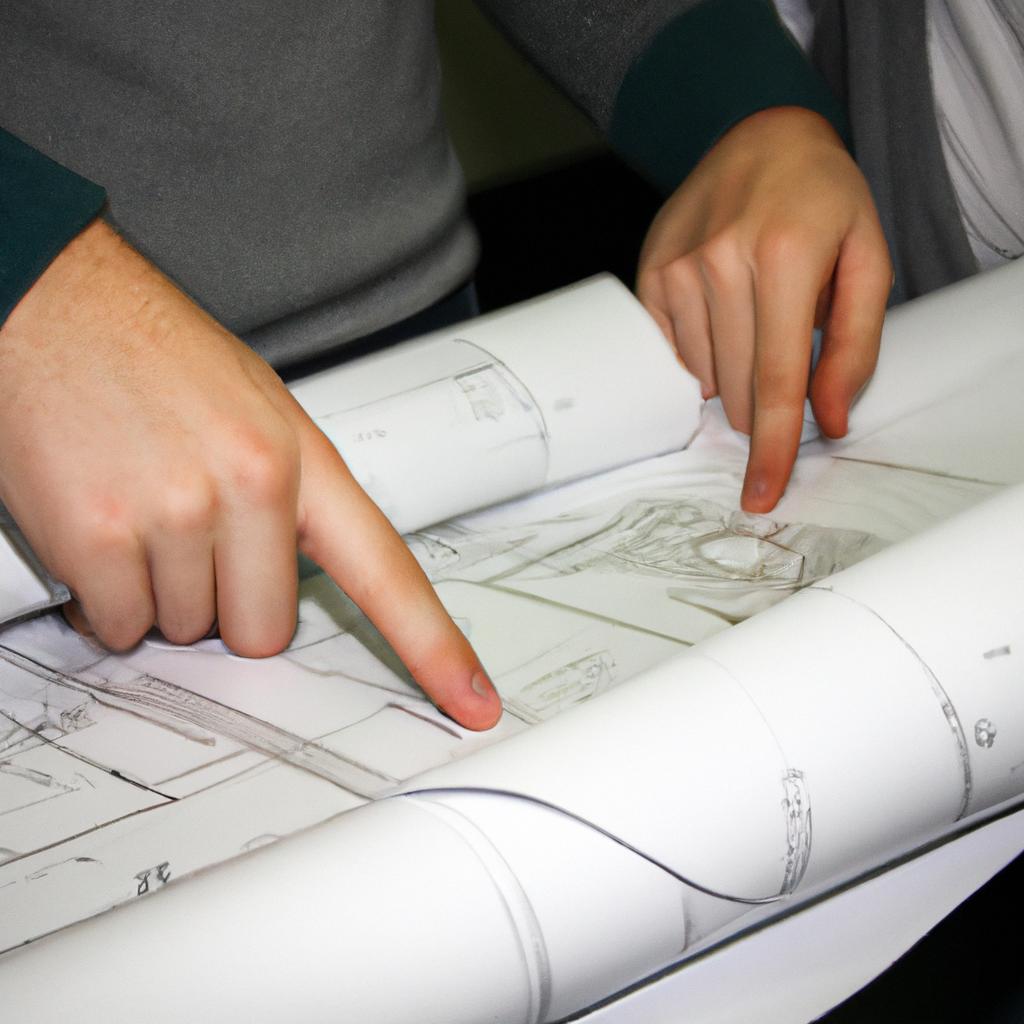 Person holding blueprints, discussing plans